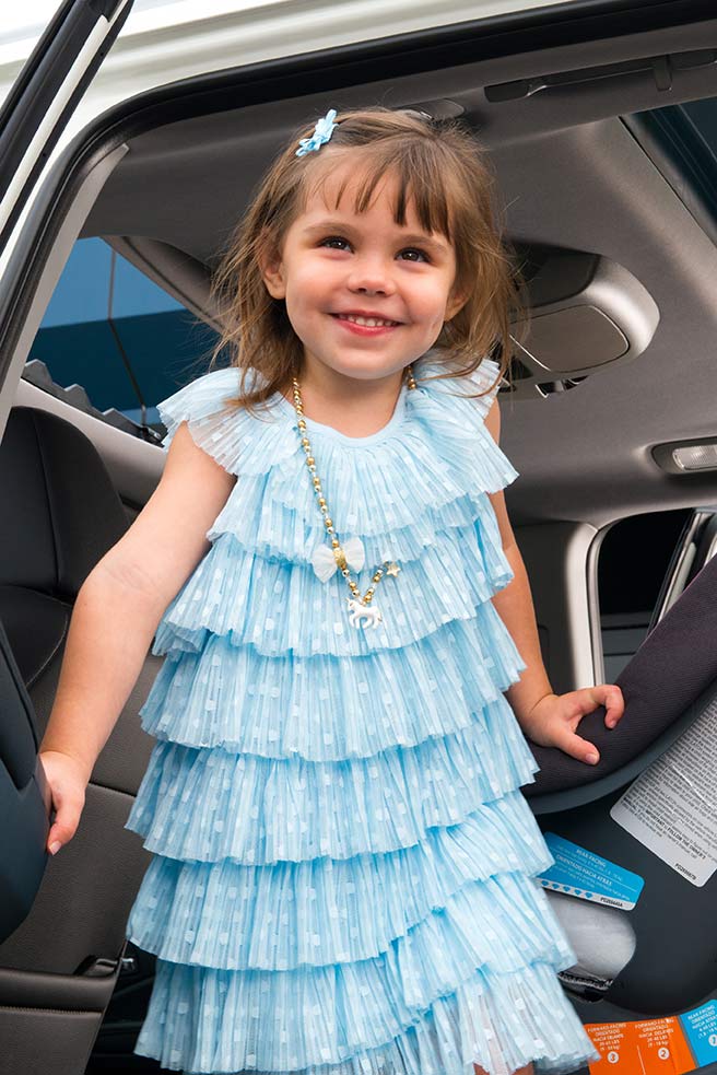 little girl in a vehicle